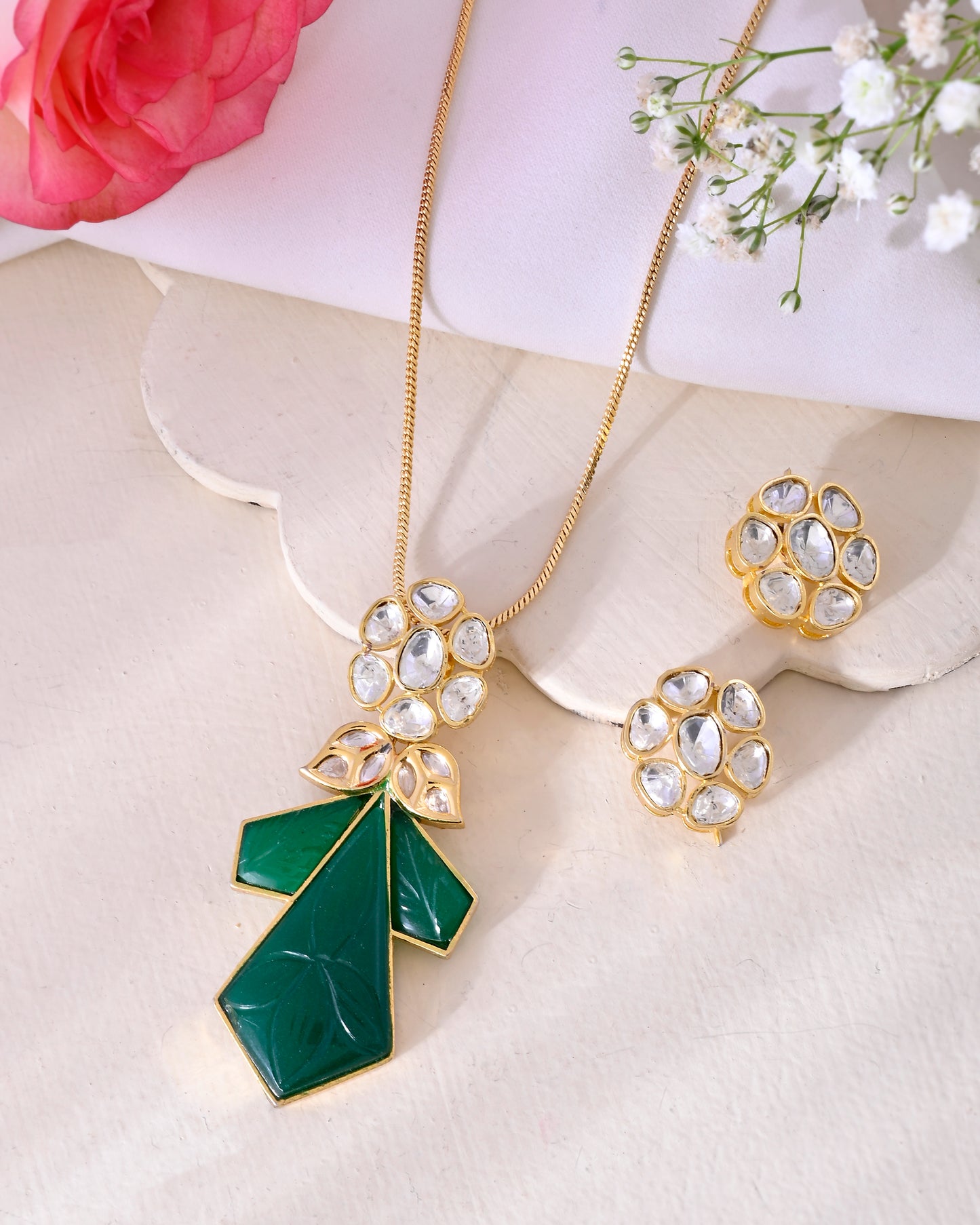 Carved stone pendant set