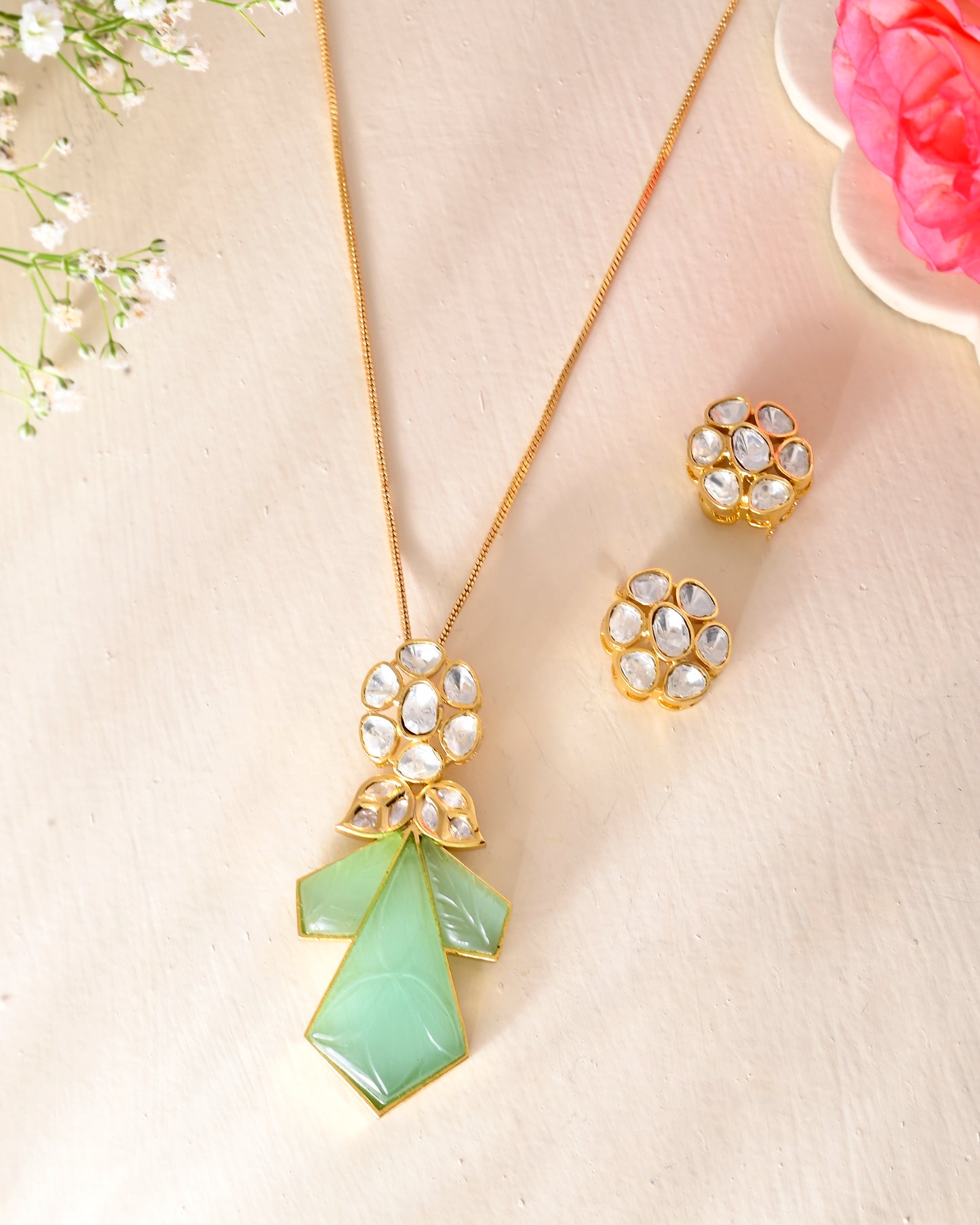 Carved stone pendant set