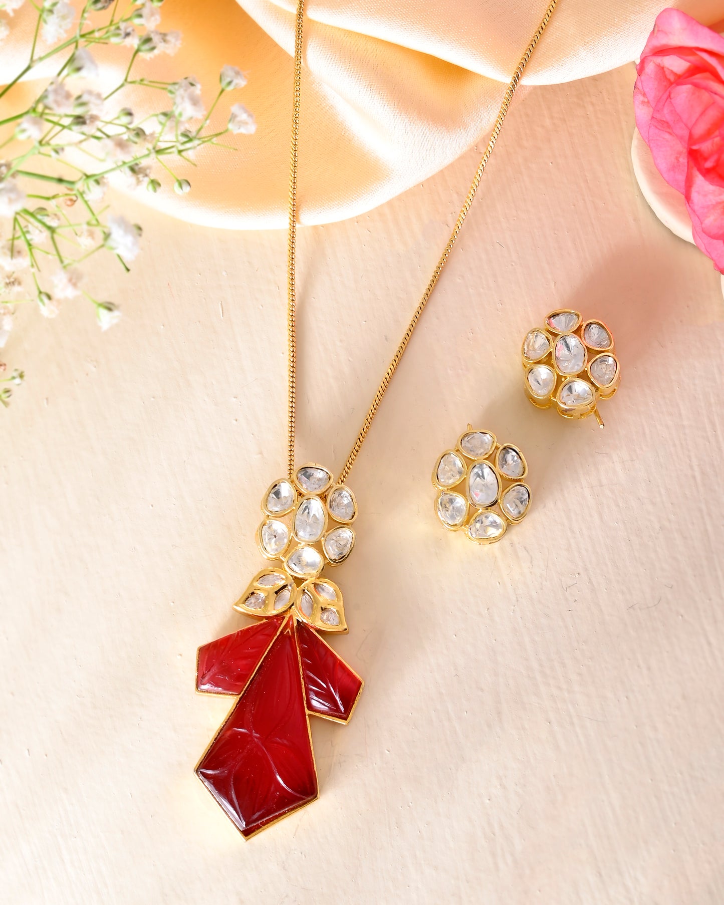 Carved stone pendant set