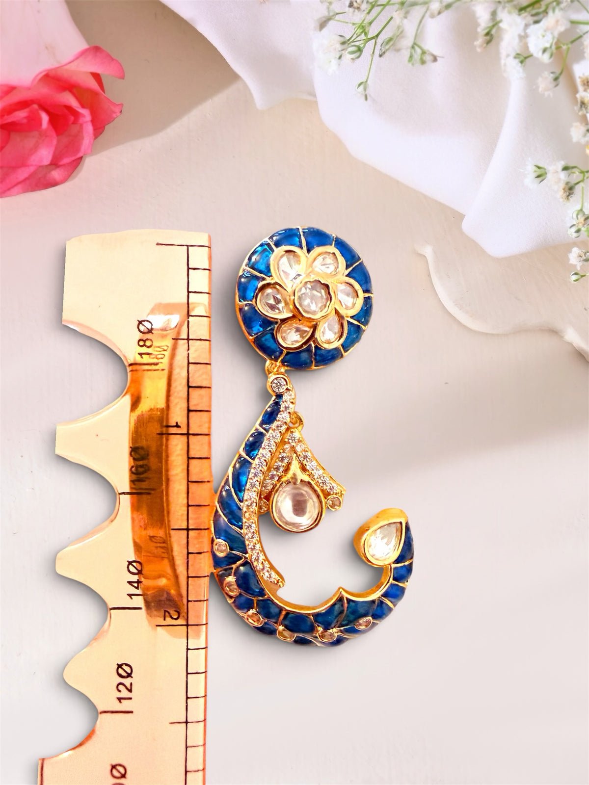 AISHI'S BOUTIQUE COLLECTION crescent-shaped drop earrings with blue enamel, gold-tone metal, and white stone accents.