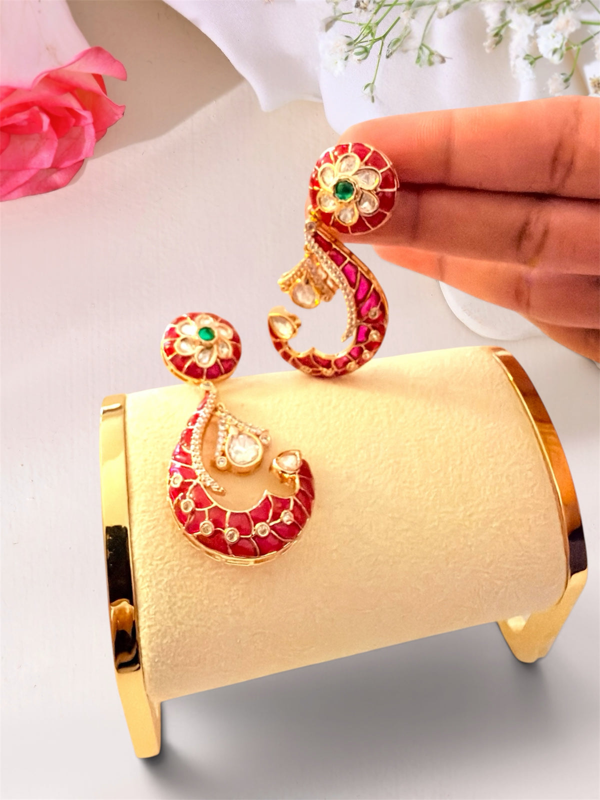 AISHI'S BOUTIQUE COLLECTION crescent drop earrings with red enamel, gold-toned metal, floral studs, and white stones.